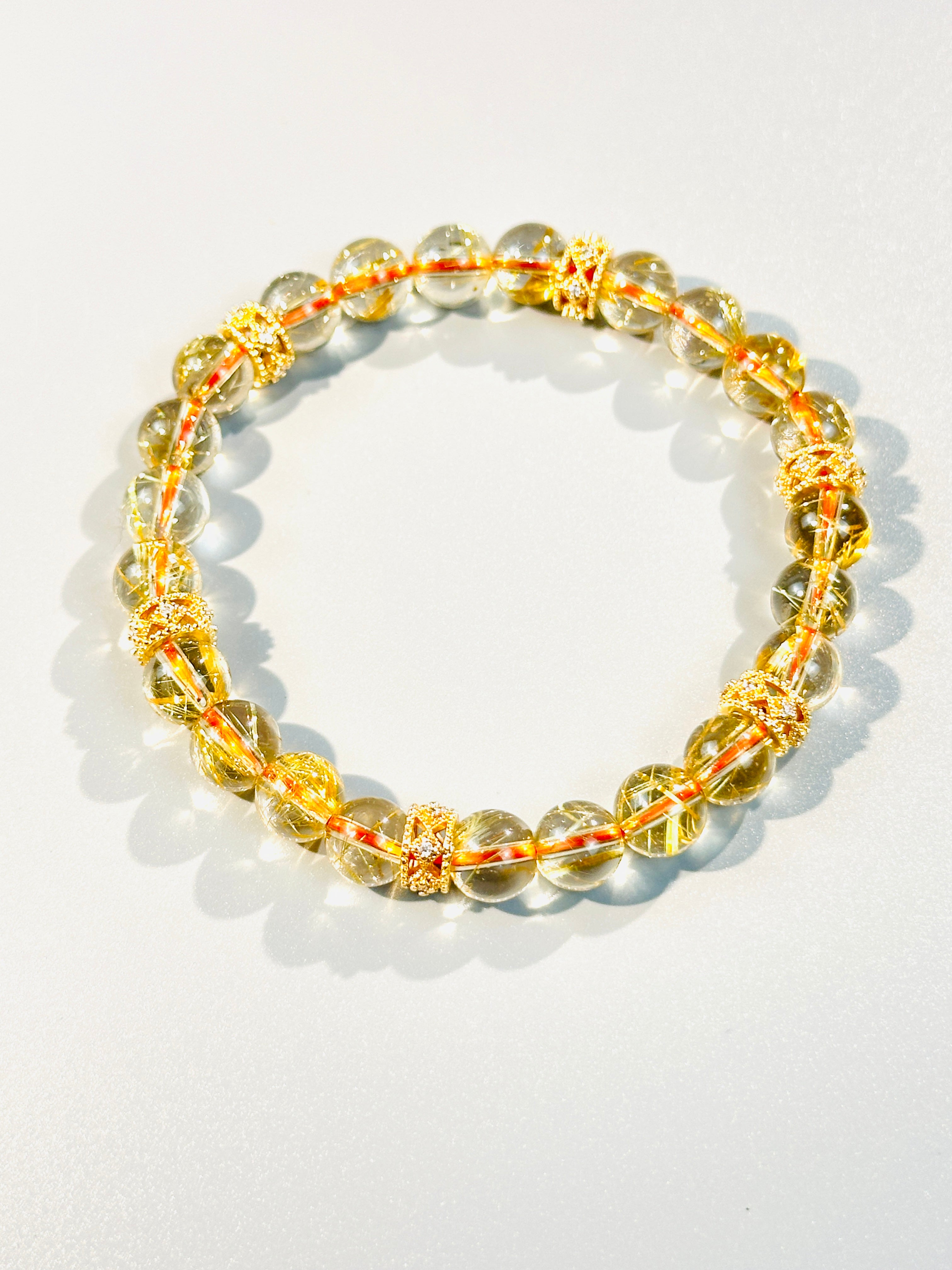 8mm Clear Titanium Rutilated Quartz Bracelet with Rose Gold Tone Spacers, Wealth Crystal