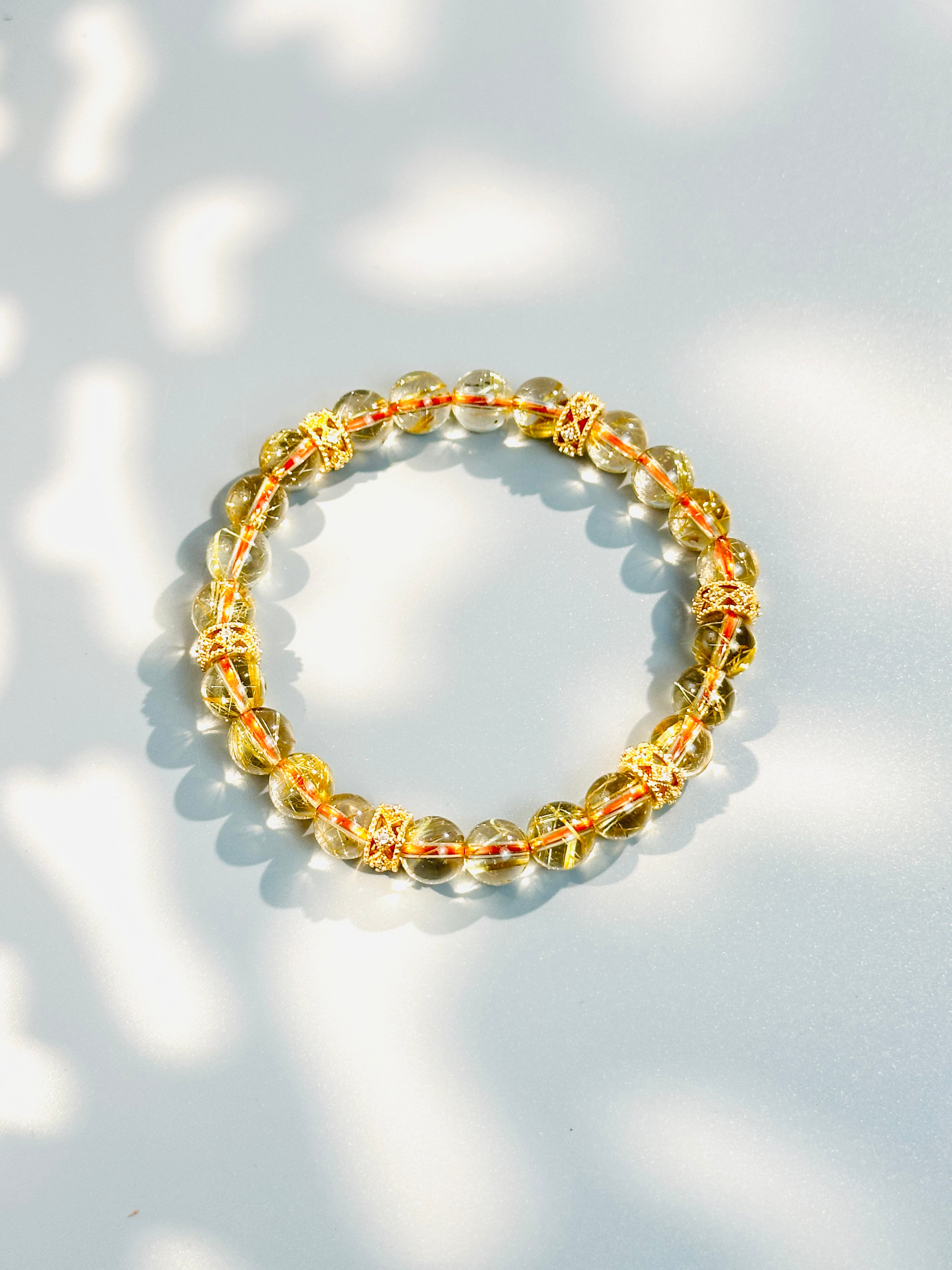8mm Clear Titanium Rutilated Quartz Bracelet with Rose Gold Tone Spacers, Wealth Crystal