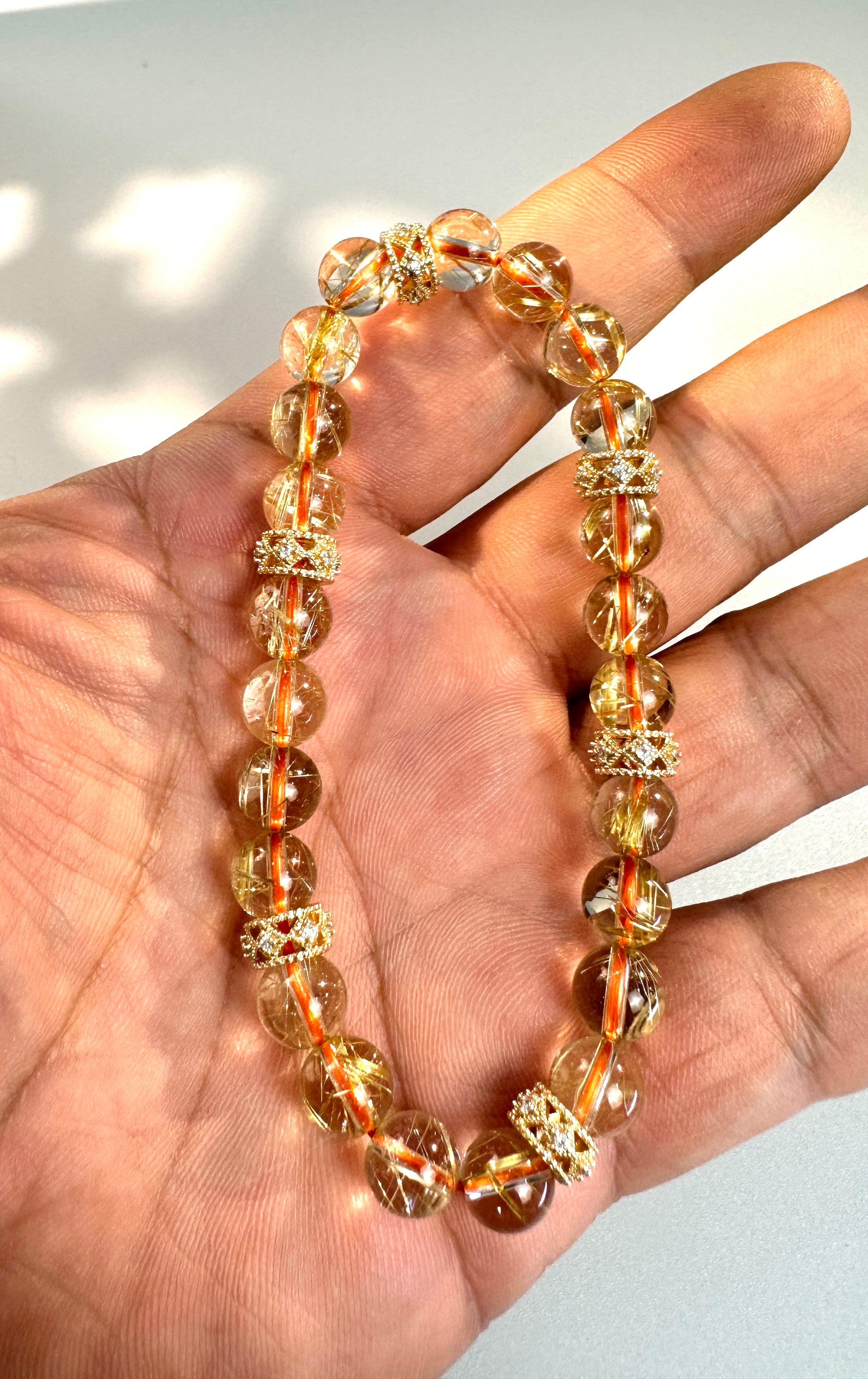 8mm Clear Titanium Rutilated Quartz Bracelet with Rose Gold Tone Spacers, Wealth Crystal